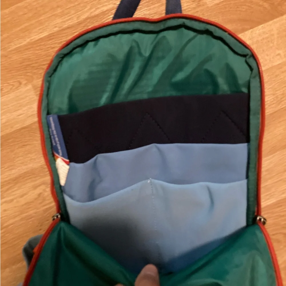 cotopaxi navy blue light blue green striped backpack